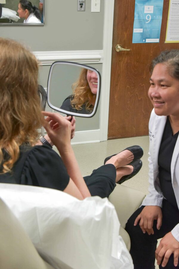 Peninsula-dermatology-carol-ipl-therapy-action-photos-3-2 Intense pulsed light therapy patient dermatologist mirror smiling happy results