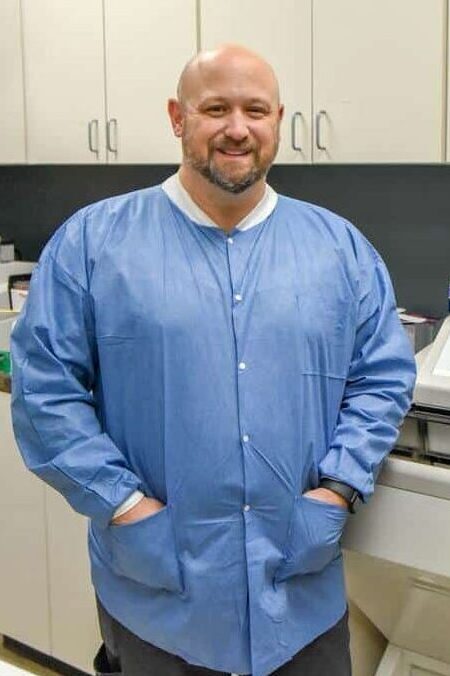 Mohs-peninsula-dermatology Dr. Mazzurco smiling in doctor office