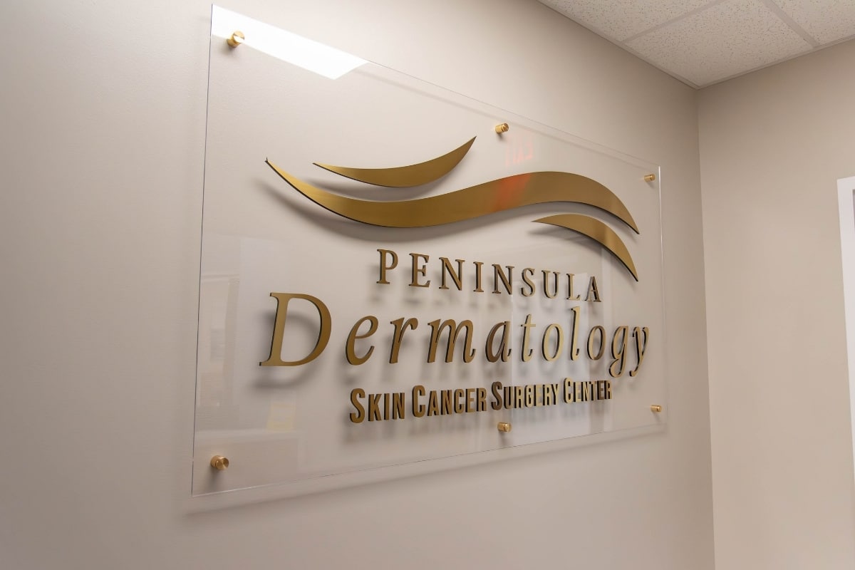 Williamsburg location 10 Peninsula dermatology logo sign gold